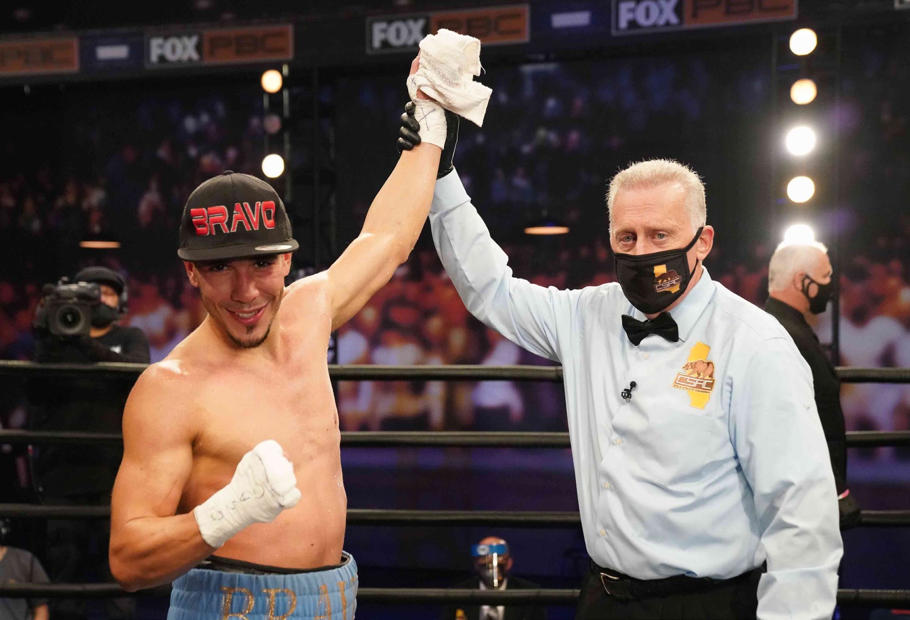 Nestor Bravo's hand raised in victory